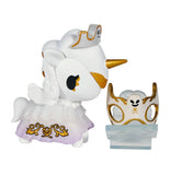 The tokidoki Unicorno After Dark Masquerade Blind Box features a striking white Unicorno figurine with gold accents and a decorative mask, displayed on a stand—an ideal collectible for any Blind Box fan.