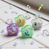 Four colorful cloud-shaped collectible figures with smiling faces and small beads inside from the Partner Toys KINGJUN Candy Lab Blind Box are displayed on a white surface with decorative crystals—ideal for fans of cute surprises.