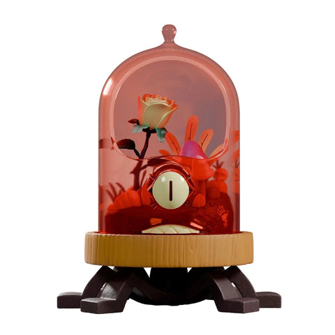 Kaleidos Creative’s Terrorium - Crab Cloche is a stylized collectible figure of a crab holding a rose under a glass dome on a four-legged wooden base, displayed in window box packaging and isolated on white.