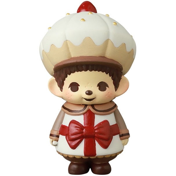 The VAG 45 — Monchhichi Happy Gift Box by Medicom is a cute Japanese vinyl toy featuring Monchhichi in a cupcake-themed outfit, ideal for fans of gachapon figures and Vinyl Artist Gacha collections.