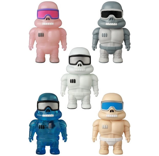Five colorful VAG 45 — Space Controller figures by Medicom—including pink, gray, white, blue, and beige—stand upright like collectible gachapon toys or Japanese vinyl figures, each wearing distinctive goggles.