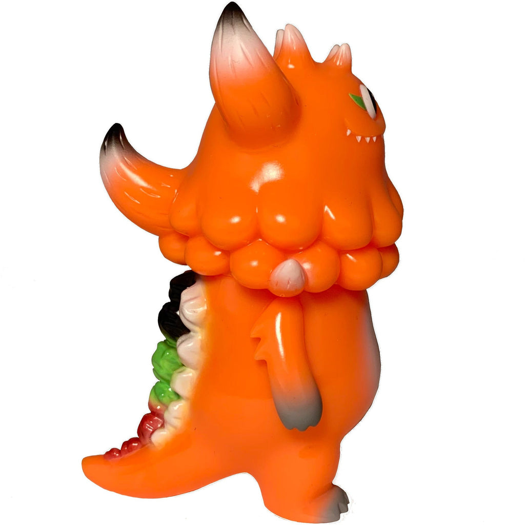 The Little Hut's Rangeas Jr. - Orange is a collectible monster figurine with black-tipped horns, green and red back spikes, and a single eye, standing upright against a white background.