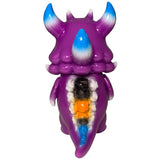 Rangeas Jr. - Purple by The Little Hut: a purple monster figurine with blue and white-tipped horns and colorful, exposed back segments—a striking collectible for fans.