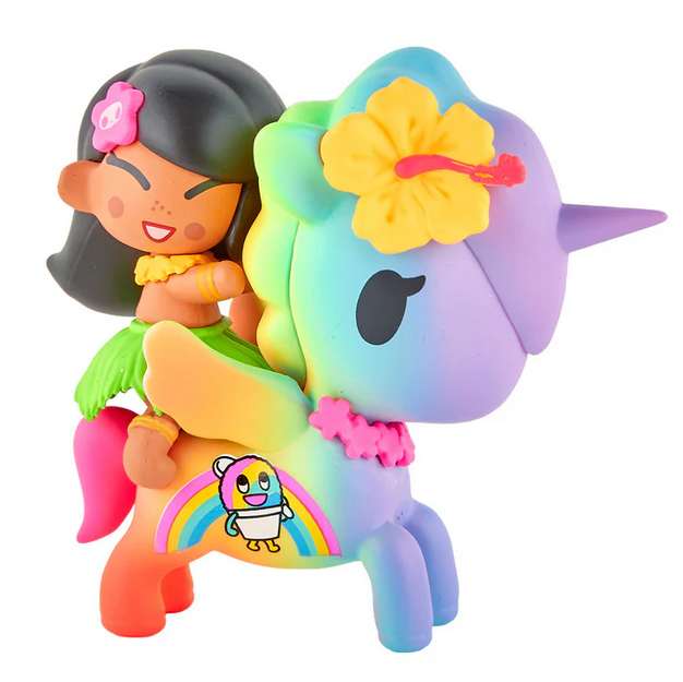 The tokidoki Hawaiian Ohana - Kailani & Anuenue (Special Edition) features a vibrant unicorn with a rainbow body, floral details, and Kailani & Anuenue in hula outfits, plus a cute bee and rainbow—an adorable collectible from tokidoki.