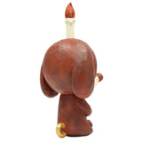The Keep Balance figurine by How2Work shows a brown meditation pup from behind, gold-tipped tail raised, with a red-flamed candle atop its head—a unique decor piece for balanced interiors.