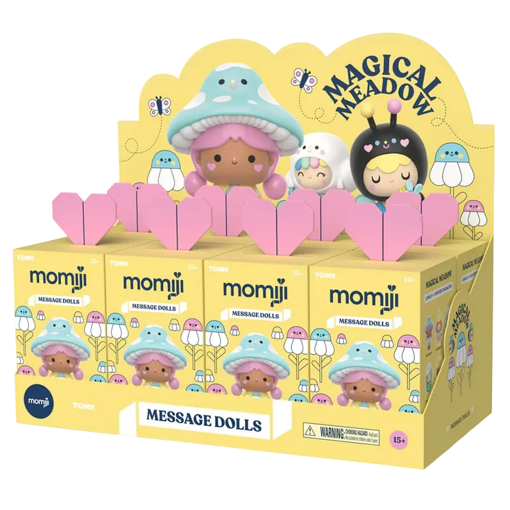 Display box of Momiji Magical Meadow Message Dolls Blind Box by Momiji, featuring colorful collectible figures with mushroom and bug hats, and several individual blind boxes arranged in rows.