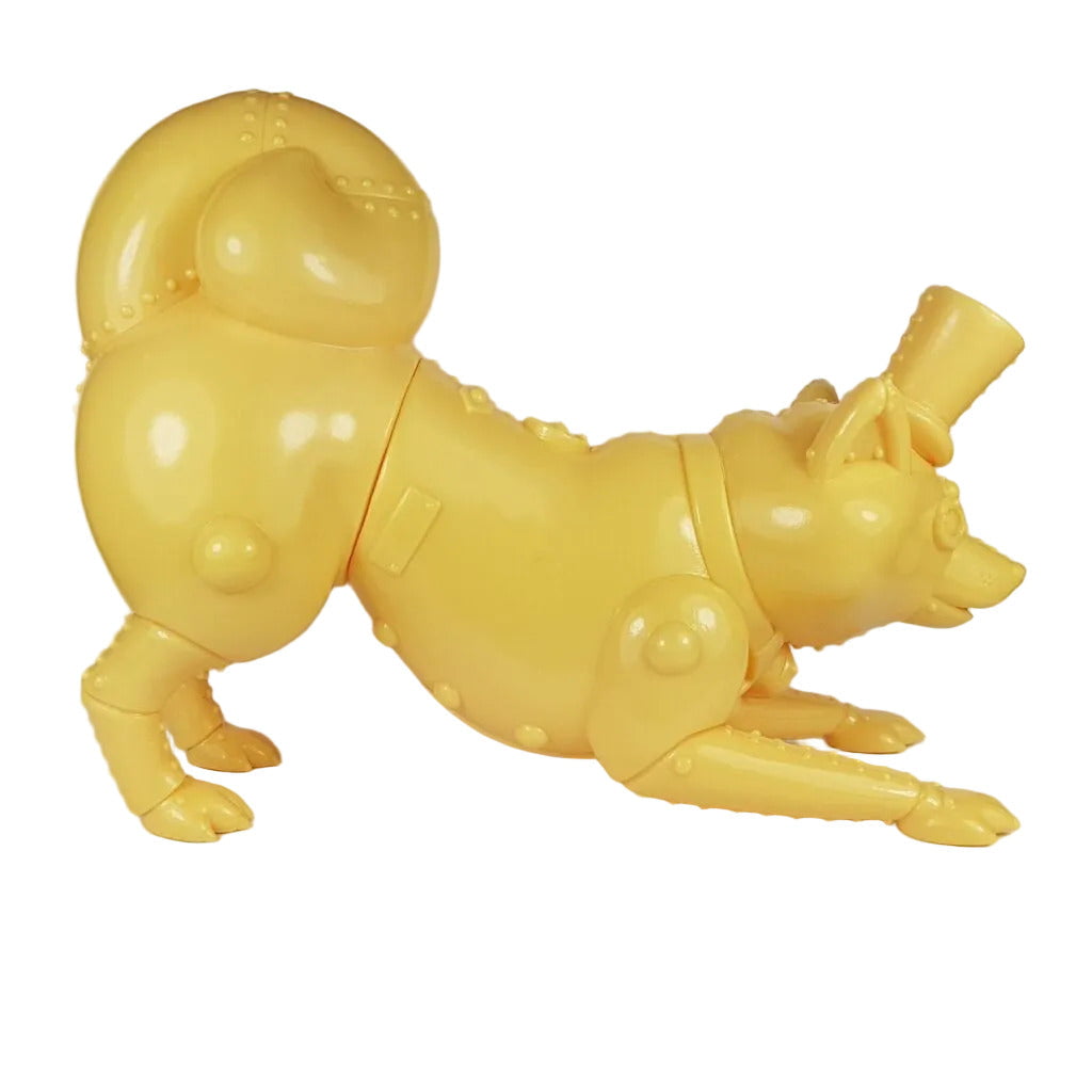 The Mugi Teaworthy - Custard Cream by Lowbrowee Toys is a yellow, segmented MECHA DOG with rivet details and a Victorian-style top hat, posed playfully stretching on a white background.