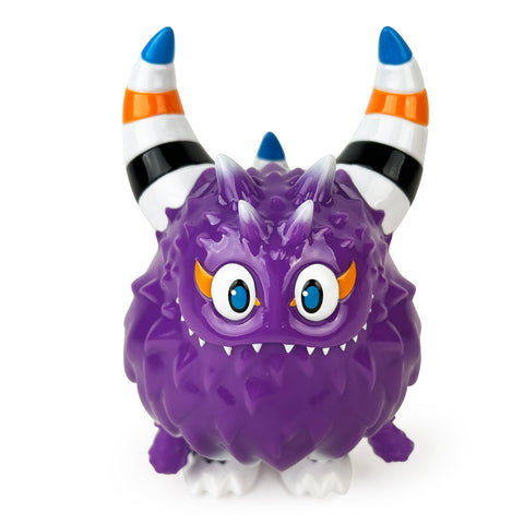 Rangeas Rex Jr. — Lollipop Purple by The Little Hut is a purple, spiky toy monster with two striped horns, big blue eyes, small fangs, a grumpy face, and four white feet.