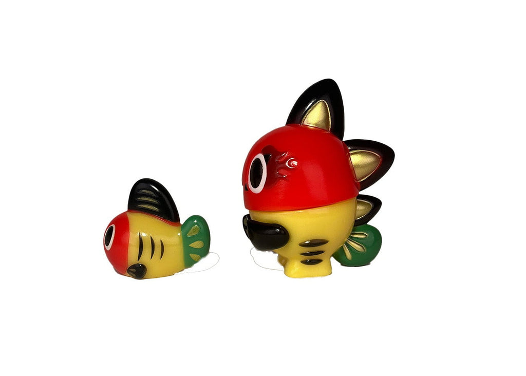 The Kibunadon Set- Original by Teresa Chiba features cute, colorful wind-up fish toys with red, yellow, green, and black details on a white background. Get yours before they’re gone!.