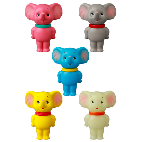 Five colorful VAG 43 — ZOU toy elephants by Medicom—pink, gray, blue, yellow, and off-white—stand upright with red collars and similar expressions. These gachapon figures are inspired by Japanese vinyl toy style.