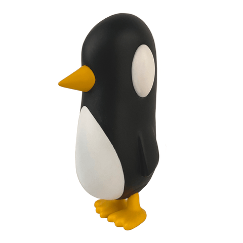 Old Friend — Original by Strangecat Toys is a black and white penguin figurine featuring a yellow beak and feet, standing upright as if waiting to catch up with an old friend, set against a white background.
