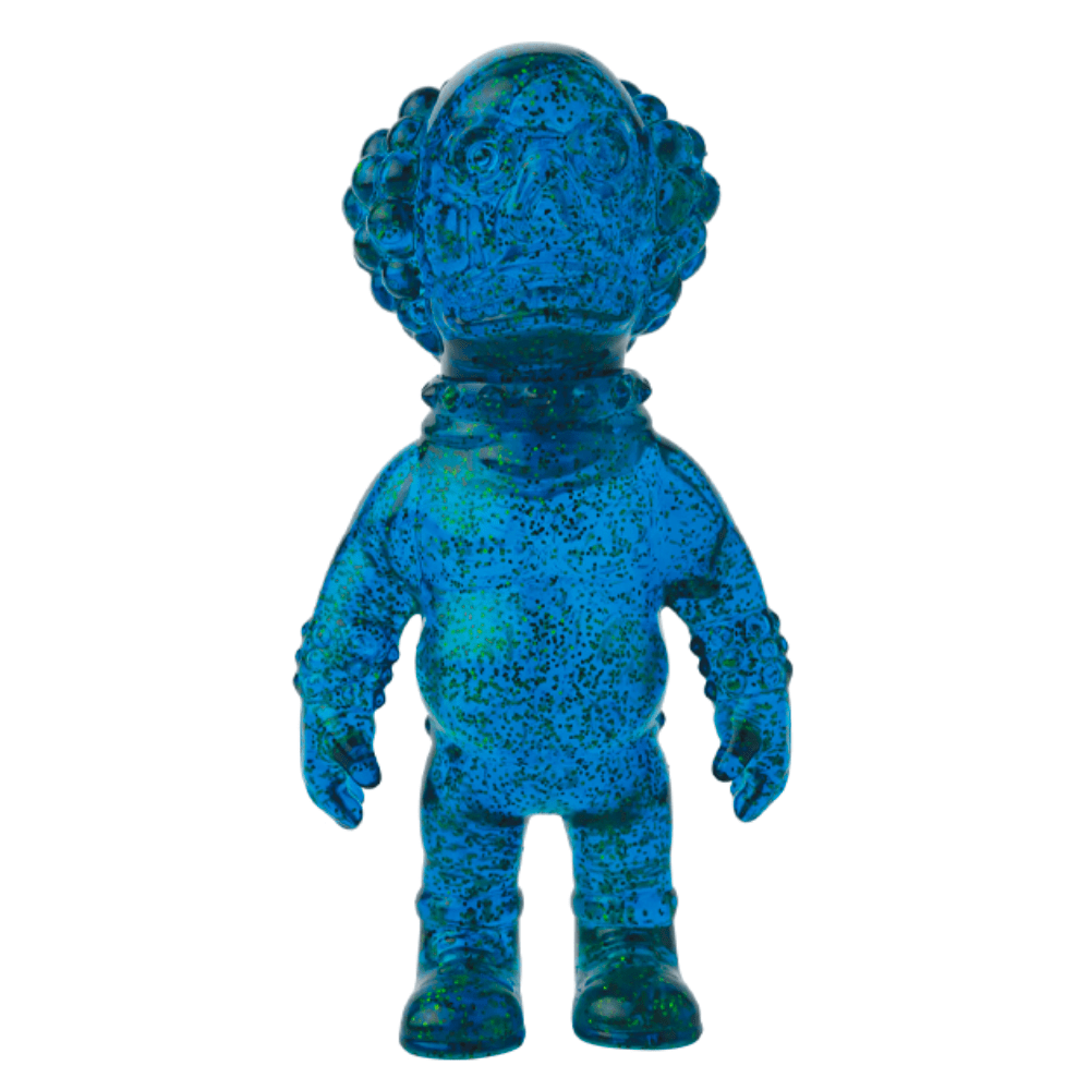 The VAG 36 - Deadman by Medicom is a blue, speckled humanoid figurine with a round head and large ears or bumps, echoing the charm of Japanese vinyl toy and gachapon figures as it stands upright against a white background.