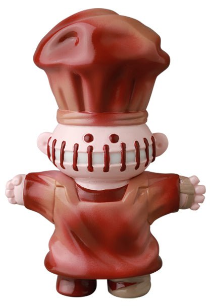 The Medicom VAG 39 — Butcher is a Japanese vinyl toy chef figure with a tall red hat, apron, stitched mouth, and outstretched arms—an eye-catching collectible for gachapon enthusiasts.