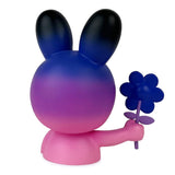 Blake Jones’ Flower Picker — Twilight by UVD Toys is a stylized pink and purple bunny figure with large ears, holding a blue flower, shown from the back against a white background.