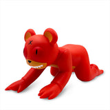 The Jermaine Rogers Creeping Dero — Original is a red bear-like vinyl collectible crouched on all fours with an X eye, inspired by the Creeping Dero and displayed against a white background.