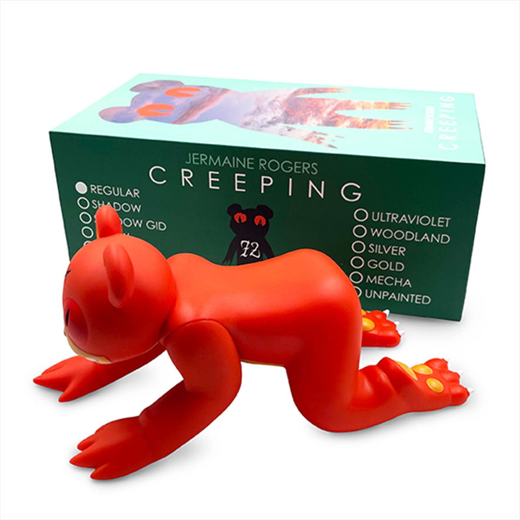 Red bear-like Creeping Dero — Original vinyl figure by Jermaine Rogers stands on all fours in front of its box, representing the unique character from the acclaimed Jermaine Rogers collection and offered in various collectible color options.