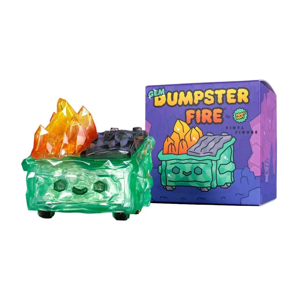 The 100% Soft Gem Dumpster Fire Vinyl Figure features translucent green vinyl, orange crystal-like flames, and a smiling face beside its colorful 