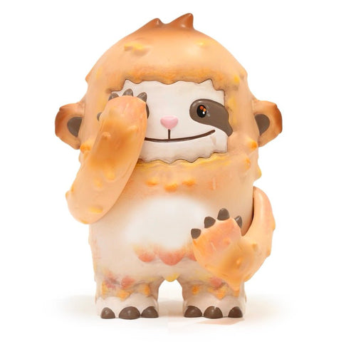 Dustin — OG by The Little Hut is a cute, cartoon sloth figurine with orange and cream fur, standing upright, smiling, and playfully covering one eye with its long arm.