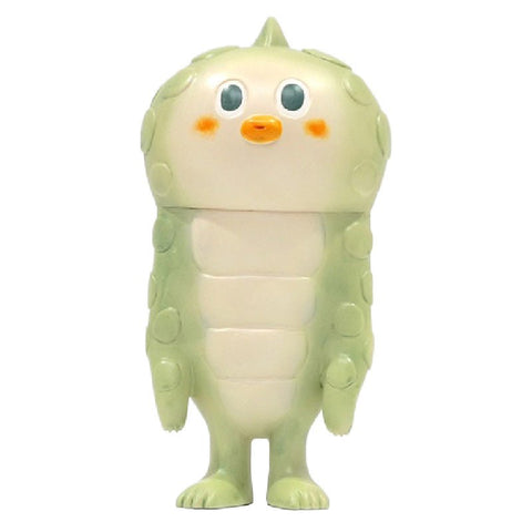 Lily — Original by How2Work is a light green, cartoon-style creature figure with round orange cheeks, a beak-like mouth, and small arms and legs, standing upright.