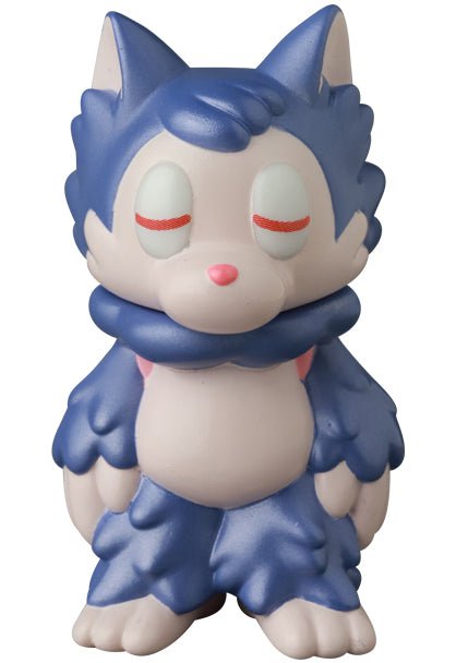 The Ookamikun — VAG 10th Anniversary by Medicom is a pale purple and blue cartoon wolf figure with closed eyes, a pink nose, and fluffy mane, standing upright like a collectible Japanese vinyl gachapon toy.