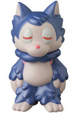 The Ookamikun — VAG 10th Anniversary by Medicom is a pale purple and blue cartoon wolf figure with closed eyes, a pink nose, and fluffy mane, standing upright like a collectible Japanese vinyl gachapon toy.