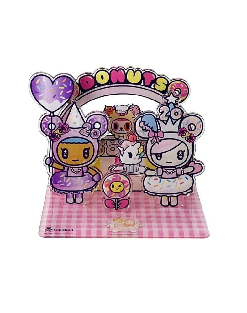 Celebrate tokidoki’s 20th Anniversary with this Acrylic Standee Blind Box—featuring cartoon characters, donuts, balloons, and a pink checkered base under a 