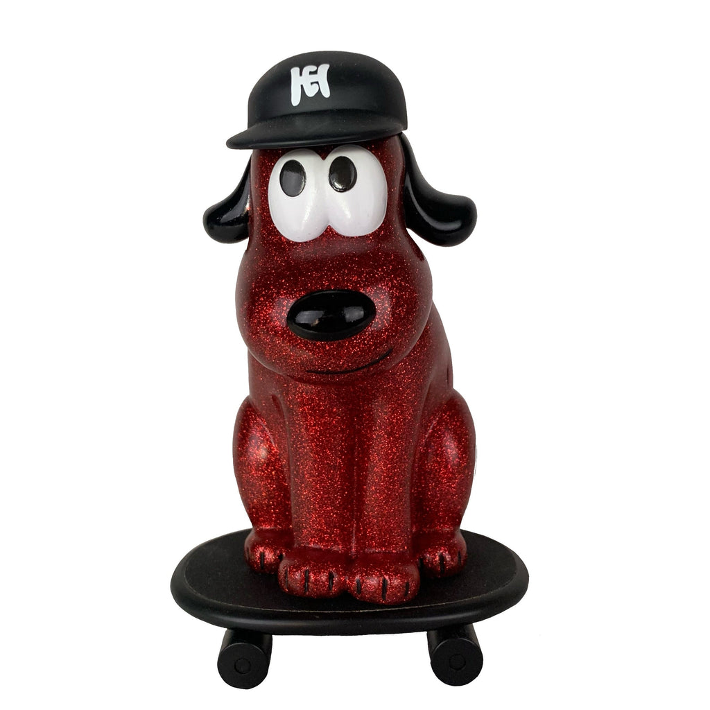 The One-Chu Sk8 - Red Glitter by How2Work is an 8-inch collectible figure with red glitter, a black cap featuring a white logo, and sits on a matching red glitter skateboard.