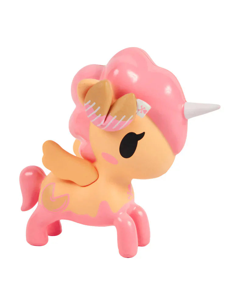 The tokidoki Fortune Cookie Unicorno Blind Box features a small pink and orange toy with wings, a white horn, and a stylized mane—perfect as a surprise collectible on a white background.