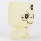 Grim Marshall by 64 Colors (Squibbles Ink + Rotofugi) is a limited edition figure with a square head, cartoon skull face, bow tie, and an 