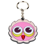The Omen Shibuya Keychain by Coarse features a playful pink owl face with bold yellow-white eyes and a red beak, attached to a sturdy metal ring—a fun accessory inspired by Shibuya street style.