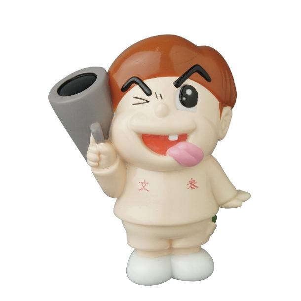 The Medicom Vinyl Artist Gacha Series 13 - Fumharu Kun features a cartoonish figurine with brown hair winking, sticking out its tongue, and holding a large gray tube—an eye-catching addition to any collection.