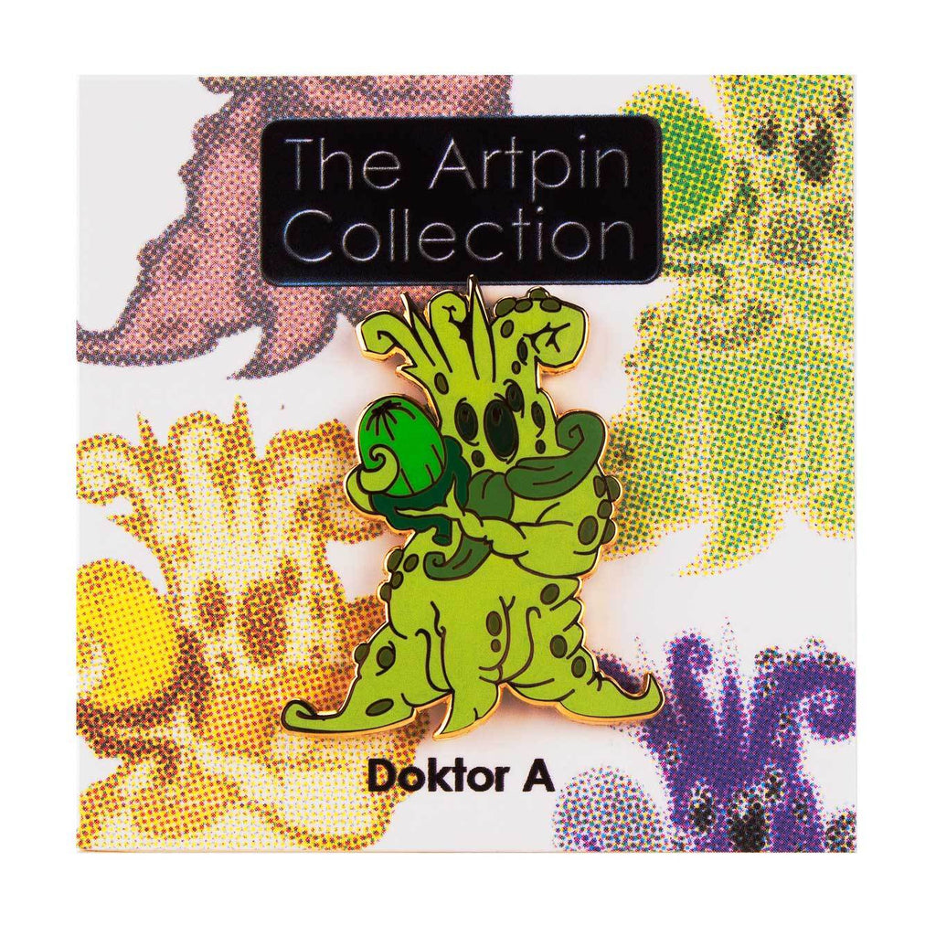 A green alien figure holding a green orb is pinned to a card labeled 
