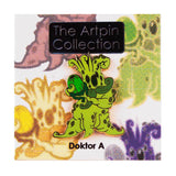 A green alien figure holding a green orb is pinned to a card labeled 