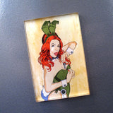 Brian Ewing Playboy Redux Acrylic Magnet by Rotofugi features a red-haired woman in a green bunny costume, cuffs, and collar, posing on a textured gray surface—available as a limited edition art magnet.
