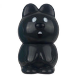 VAG 33 - Kuokka Chan by Medicom is a black bear-shaped vinyl figurine with round ears, white oval eyes, and a small open mouth—part of the Japanese Vinyl Artist Gacha collection.