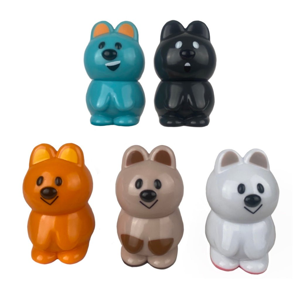 Five VAG 33 - Kuokka Chan figures by Medicom in blue, black, orange, brown, and white stand upright in two rows on a white background, highlighting these collectible Japanese vinyl toy charms.