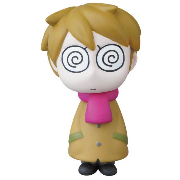 Edward the Timid Friend from VAG Series 25 by SONIC (Medicom) is a cartoon figure with brown hair, spiral eyes, tan coat, green pockets, pink scarf, and black shoes—styled like a Japanese vinyl collectible.