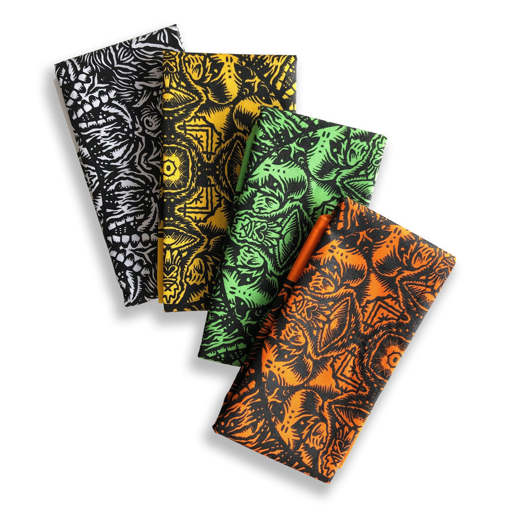 Four Cherry Moth Cake Bandanas by Cherry Moth Cake, each featuring intricate abstract patterns in black and white, yellow and black, green and black, and orange and black, are fanned out on a white background.