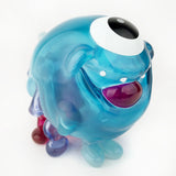 The Gellog — Type-D (Rotofugi Exclusive) by Strangecat Toys is a glossy, blue, round toy with one large eye, wide mouth, tiny arms and legs, and a translucent finish—perfect for any playful collection.