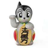 Maneki-Astro — Silver Metallic Flake by DoomCo Designs is a Rotofugi exclusive collectible with cat ears, cartoon eyes, a gold coin with Japanese writing, and a raised left paw—perfect for unique vinyl figure fans.