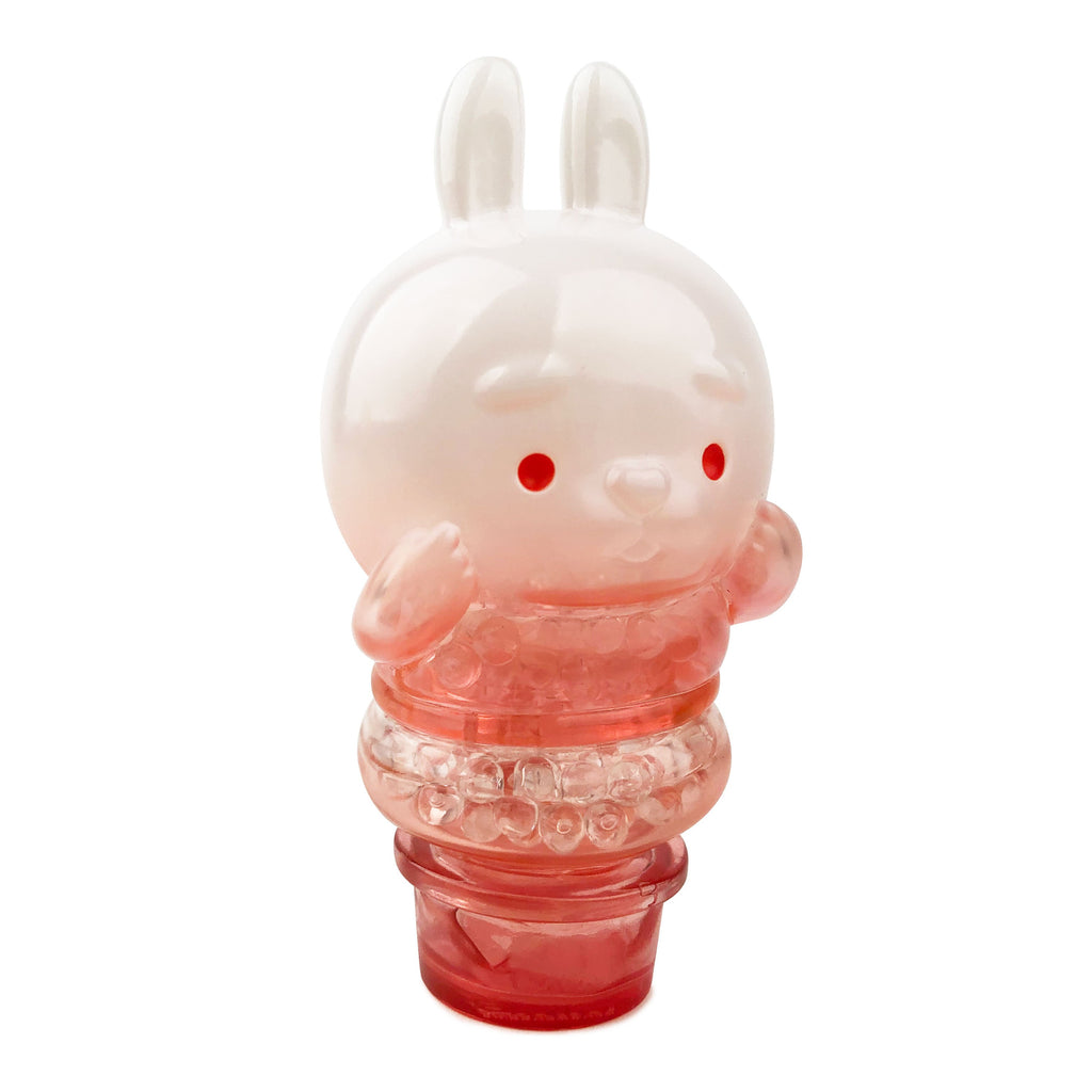 The Sun Day Toy Meng Meng Bing — Bunny Popsicle Mini-Figure is a pink and white bunny with a round head, small ears, and red eyes, filled with translucent beads—ideal for fans of animal-shaped collectibles.