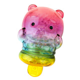 The Meng Meng Bing — Panda Popsicle Mini-Figure by Sun Day Toy is a bear-shaped collectible with a transparent body filled with pink, purple, green, and yellow beads, finished with a yellow tag at the bottom.