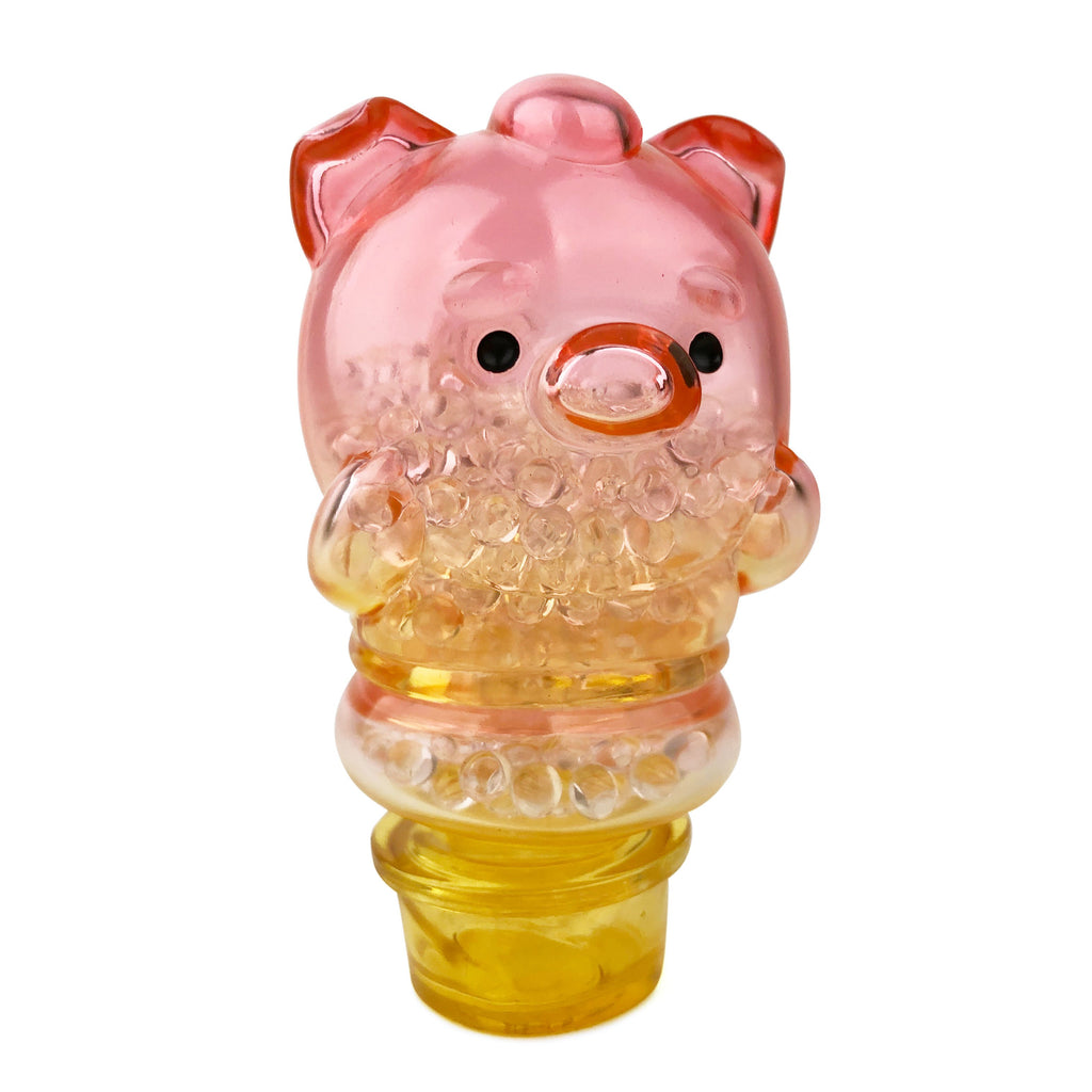 The Meng Meng Bing — Pig Popsicle Mini-Figure from Sun Day Toy is a translucent pink and yellow pig-shaped container with black eyes, a snout, and clear beads inside.