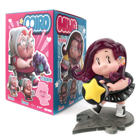 A LAM Toys Miro & Wujo Blind Box vinyl figurine of a girl with long purple hair holding a yellow star is shown in front of its colorful box featuring playful product illustrations and branding.