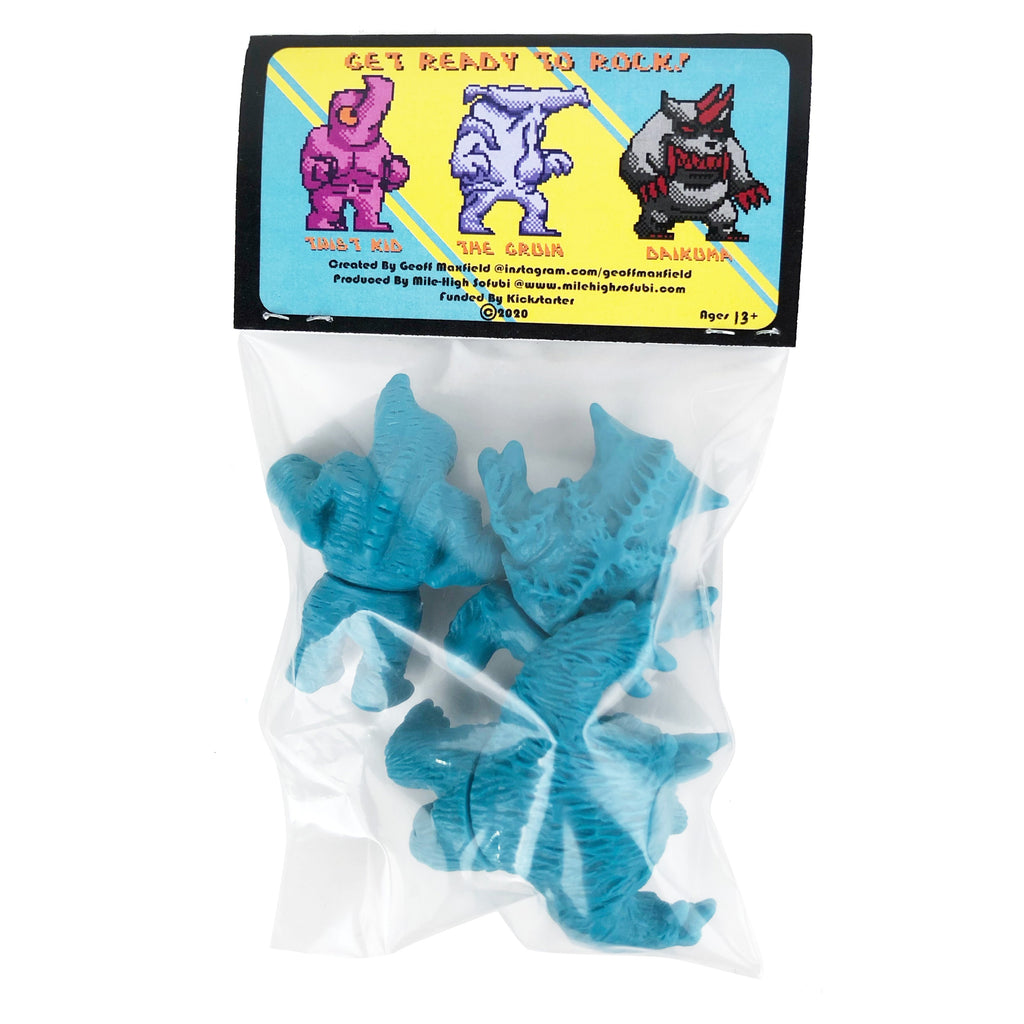 A clear plastic bag with blue monster figurines and a colorful 