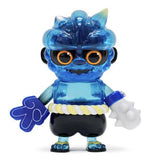 Oniki — Clear Blue by How2Work is a blue, translucent sofubi figure inspired by Japanese yokai Oni, featuring large orange eyes, black shorts, white rope belt, blue gloves, and a white spiked mace in its left hand.